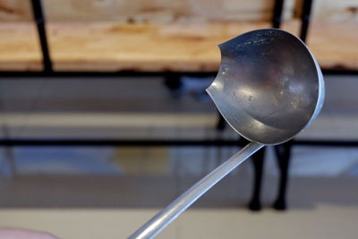 Close-up of water drop on metal