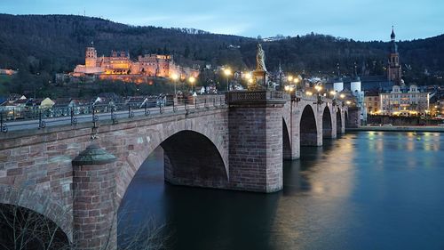 Heidelberg beautiful old bridge plus castle at dusk