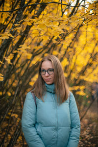 Portrait of young woman in autumn