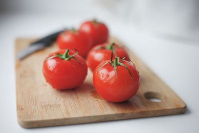 Close-up of tomatoes on cutting board