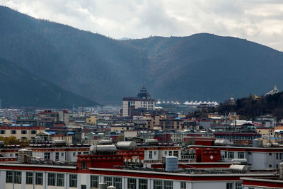 Aerial view of townscape against sky