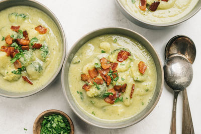 Potato and broccoli soup with bacon table setting