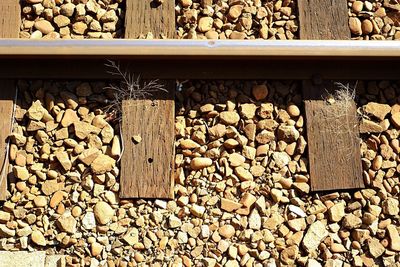 High angle view of stones on railroad track