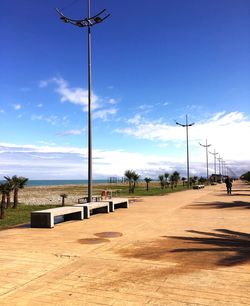 Scenic view of park against blue sky