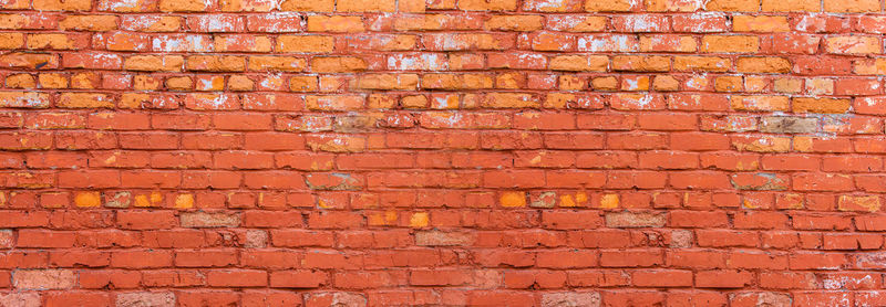 Red old brick wall background or texture. selective focus