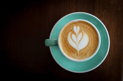 Close-up of cappuccino on table