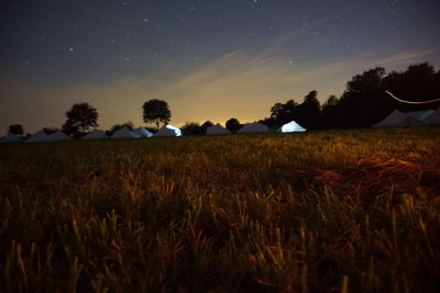 Scenic view of agricultural field against sky at night