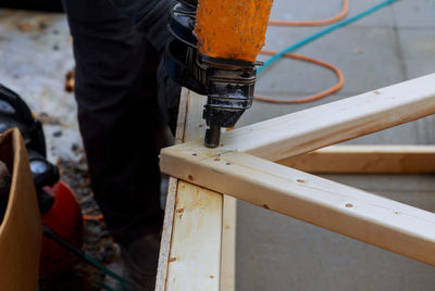 Low section of man working on wood