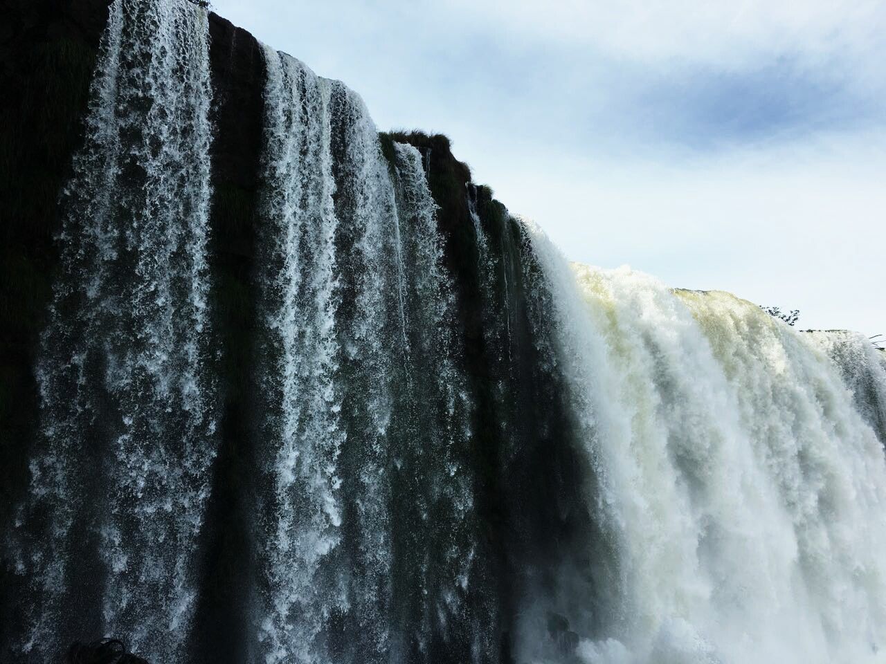 motion, waterfall, long exposure, water, flowing water, nature, beauty in nature, blurred motion, no people, rock - object, power in nature, sky, scenics, day, outdoors, cliff, wave, force