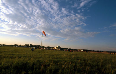 Scenic view of field against sky at sunset