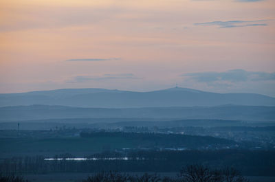 Scenic view of mountains against sky during sunset