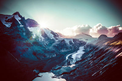 Scenic view of snowcapped mountains against sky