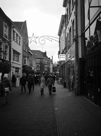 People walking on street in city