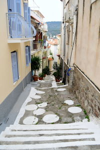 Alley amidst buildings in city