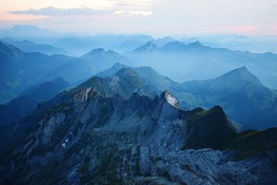 Scenic view of mountains against sky during sunset