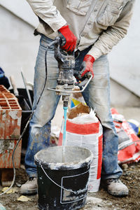 Low section of man working on concrete