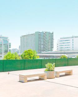 View of modern buildings against clear blue sky