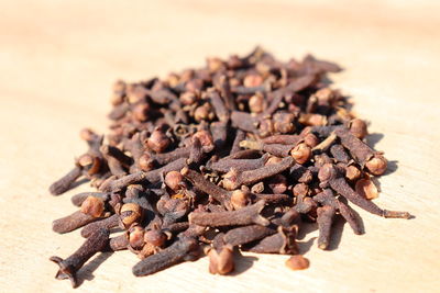 Close-up of coffee beans on table