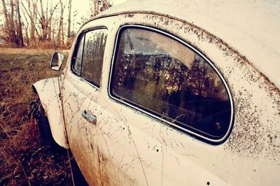 Close-up of car on road