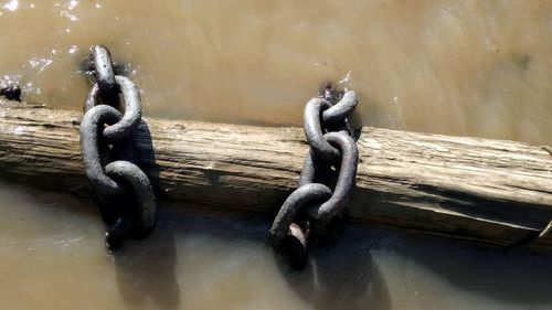 Close-up of rope tied on metal