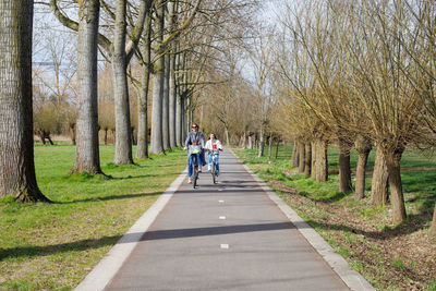 Mother and son cycling on a sunny day