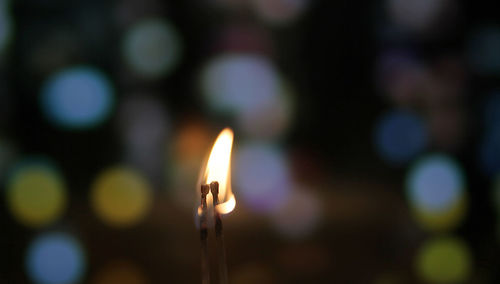 Close-up of illuminated candles