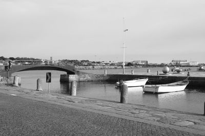 Boats moored in river