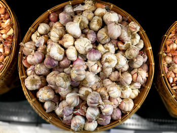 Directly above shot of garlics in basket