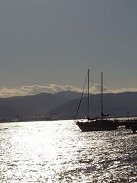 Sailboat sailing on sea against clear sky