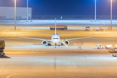 View of airplane at airport runway