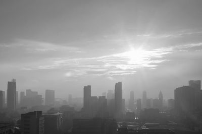 View of city against cloudy sky