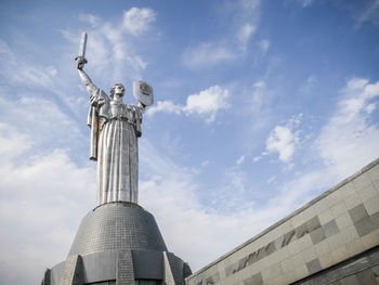 Low angle view of statue against sky