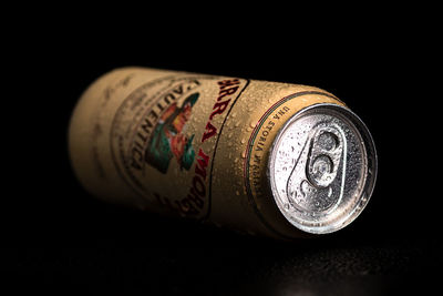 High angle view of coins on black background