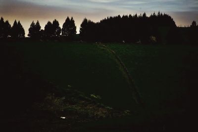 Scenic view of landscape against sky at sunset