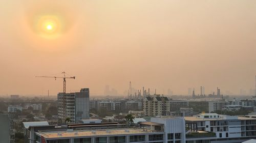 Cityscape against sky during sunset