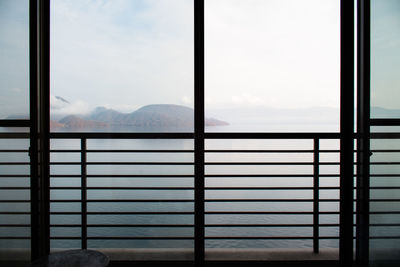 Scenic view of mountains seen through window