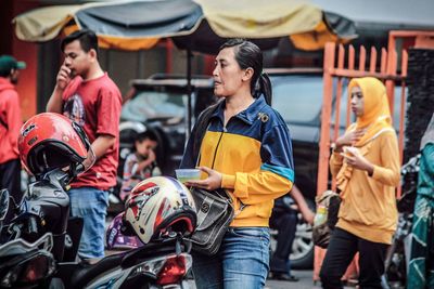 People on road in city