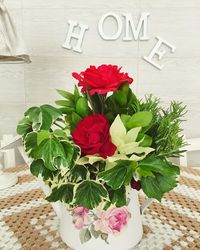 Close-up of red rose on table