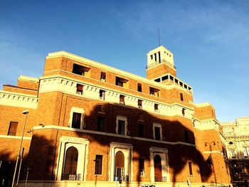 Low angle view of building against blue sky