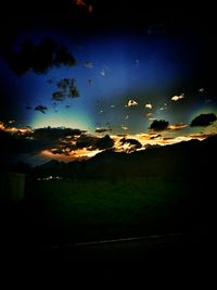 Scenic view of landscape against sky at night