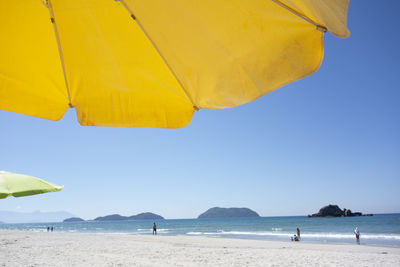 Beach tents and the sea at sundown.