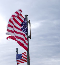 Low angle view of flag against sky