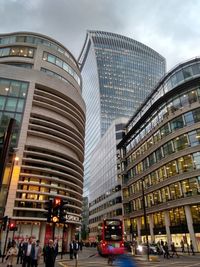 Low angle view of modern buildings in city against sky