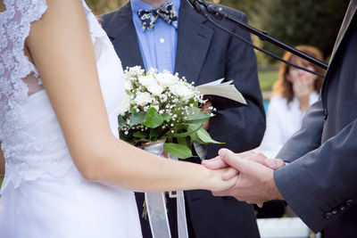 Close-up of woman holding flower