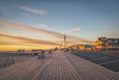 View of pier over sea against sky during sunset