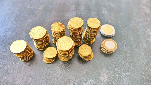 High angle view of coins on table