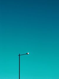 Low angle view of street light against sky