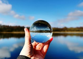 Image of hand holding crystal ball