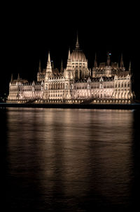 Illuminated hungarian parliament building against sky at night