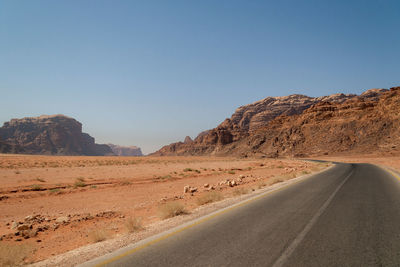 Scenic view of desert against clear sky